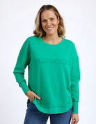 Foxwood Simplified Crew in bright green with round neck, raw edge details, and side splits for a relaxed, everyday look.