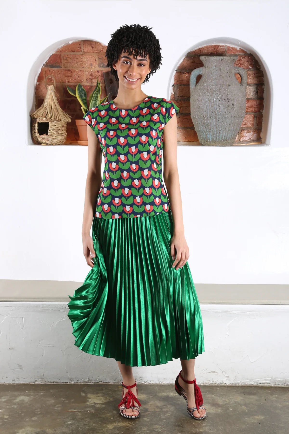 The Green Peace Lily Pleated Skirt by Olga de Polga is currently available at Rawspice Boutique. 