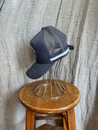 Rocks Hat in black featuring a whale tail design on the front, snapback closure, and breathable mesh sides for a comfortable, adjustable fit.