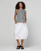 Guru Skirt in Coconut featuring a 3/4 length, stretch drawstring waistband, front and back pockets, full lining and black contrast stitching.