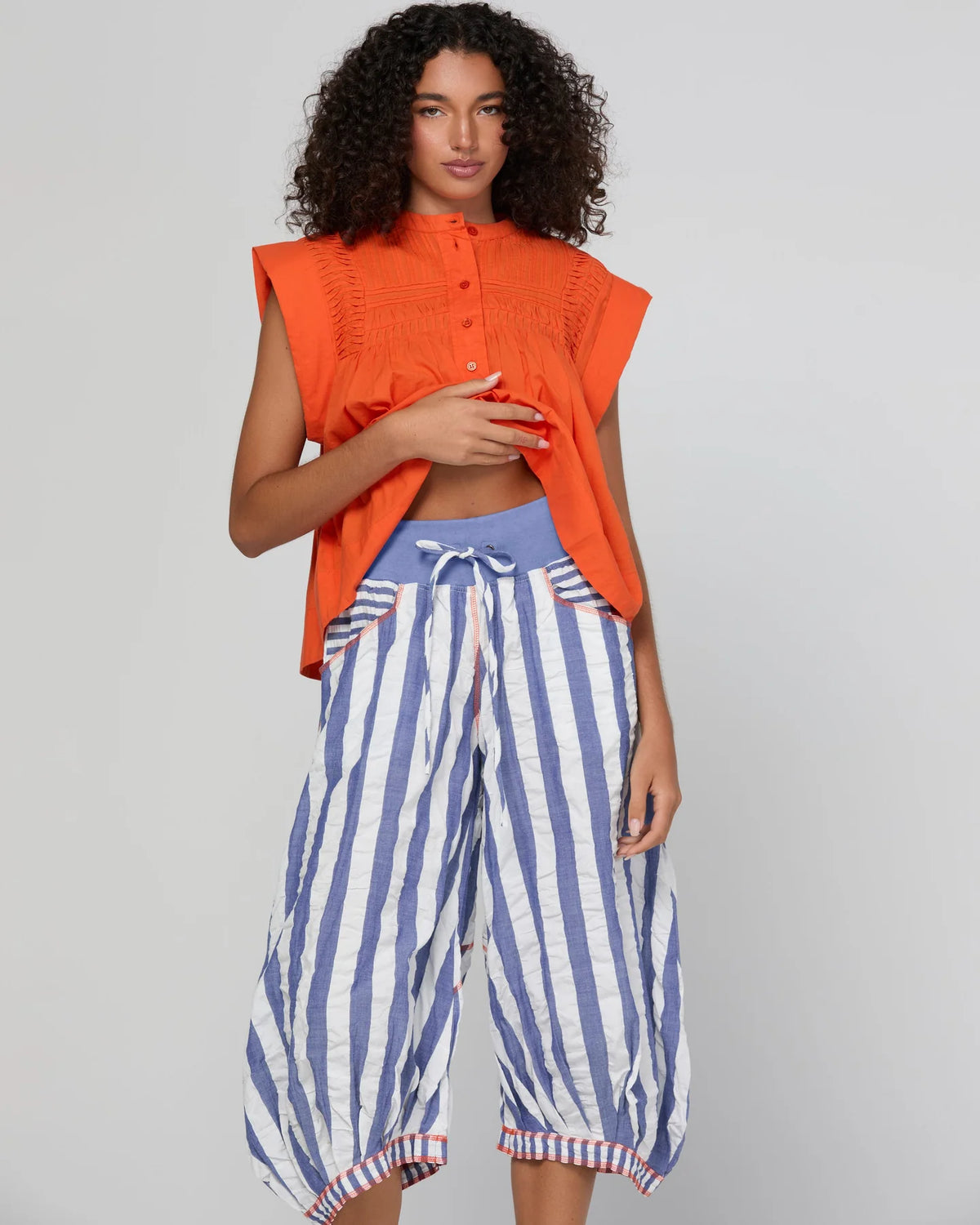Boom Shankar Guru Pant in Ocean Stripe featuring blue and white stripes, a drawstring waistband, balloon-style legs and 3/4 length.