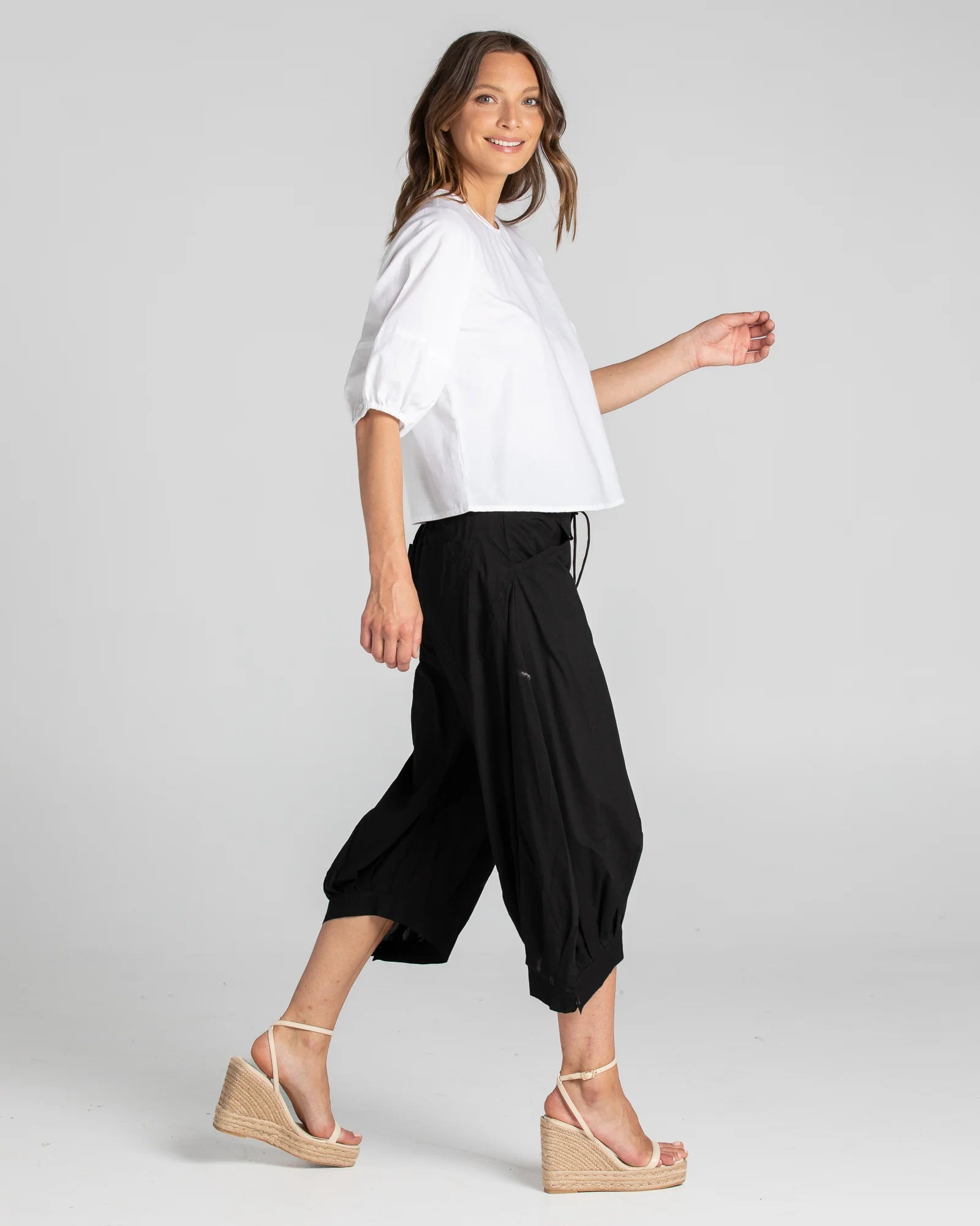 Boom Shankar Guru Pant in Coffee, featuring a relaxed fit with a drawstring waistband, 3/4 length, front and back pockets, and signature seam detailing.
