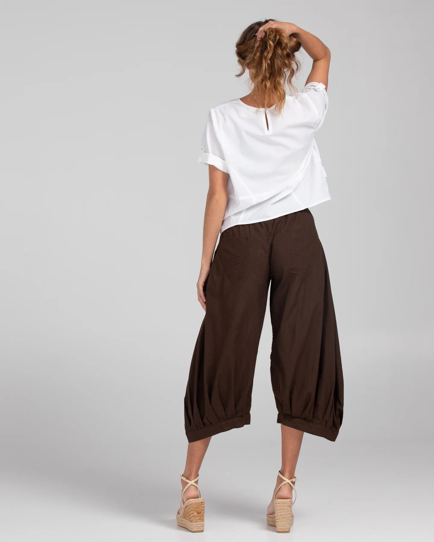 Boom Shankar Guru Pant in Coffee, featuring a relaxed fit with a drawstring waistband, 3/4 length, front and back pockets, and signature seam detailing.