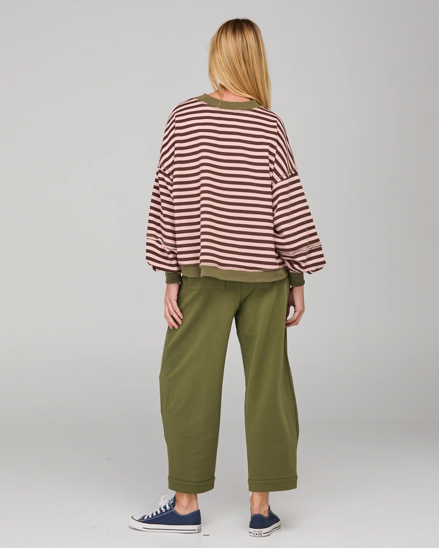 Dusty pink striped oversized sweater with cropped fit, balloon sleeves, ribbed trims and contrast stitching detail.