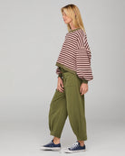 Khaki relaxed fit track pants with drawstring waist, ribbed waistband, contrast stitching and pockets front and back.