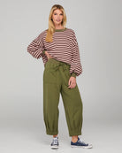 Khaki relaxed fit track pants with drawstring waist, ribbed waistband, contrast stitching and pockets front and back.