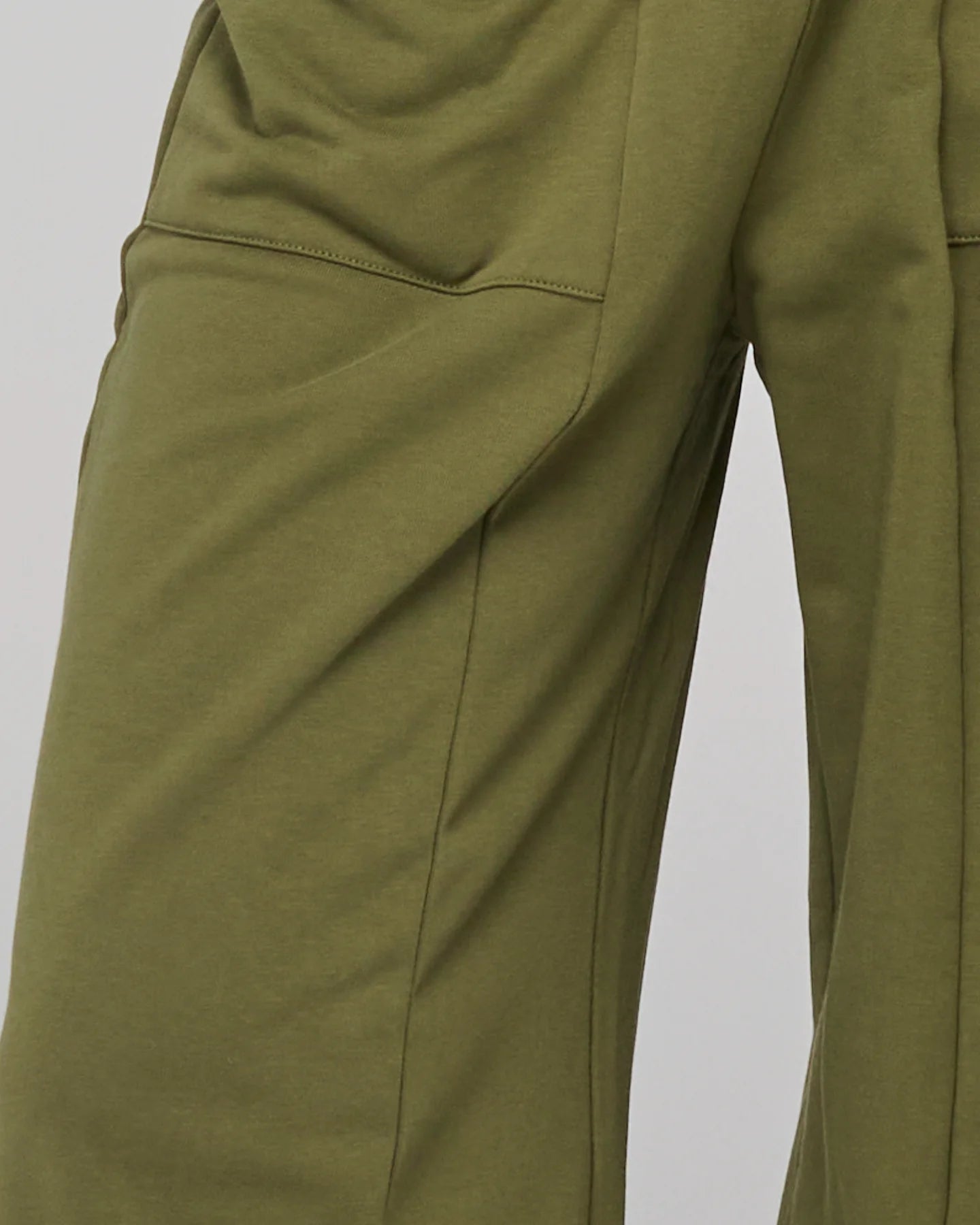 Khaki relaxed fit track pants with drawstring waist, ribbed waistband, contrast stitching and pockets front and back.