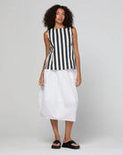 Guru Skirt in Coconut featuring a 3/4 length, stretch drawstring waistband, front and back pockets, full lining and black contrast stitching.
