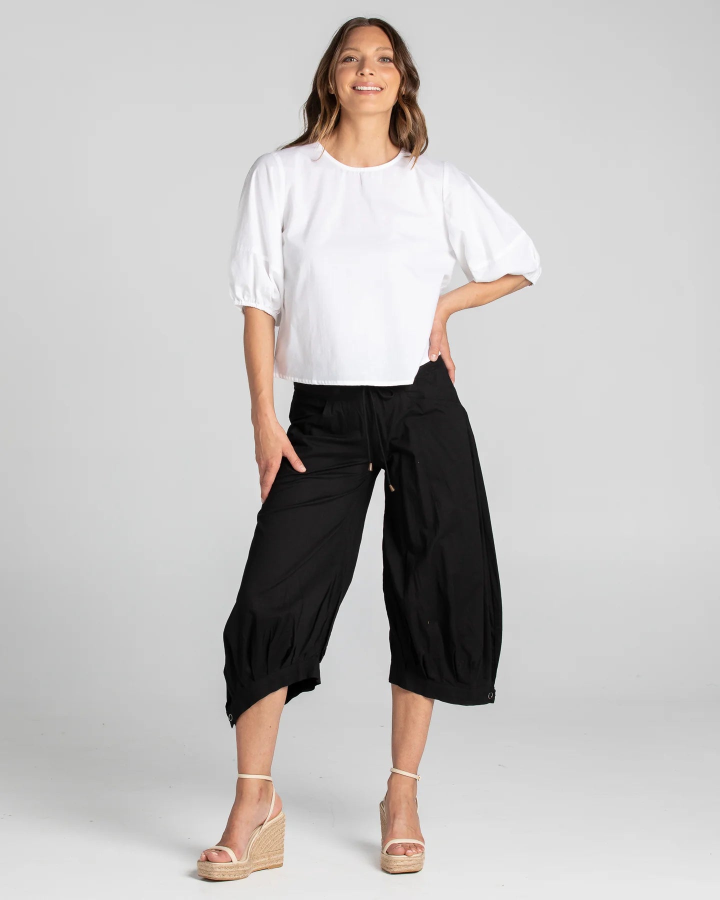 Boom Shankar Guru Pant in Coffee, featuring a relaxed fit with a drawstring waistband, 3/4 length, front and back pockets, and signature seam detailing.