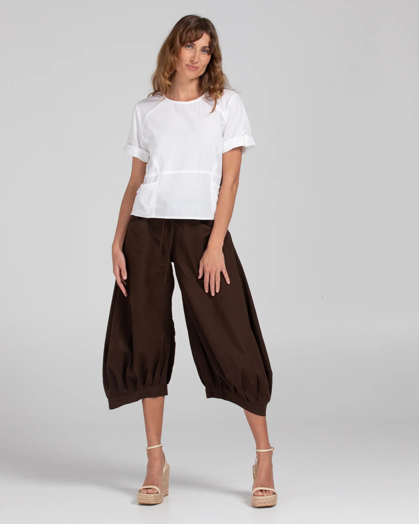 Boom Shankar Guru Pant in Coffee, featuring a relaxed fit with a drawstring waistband, 3/4 length, front and back pockets, and signature seam detailing.