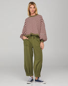 Khaki relaxed fit track pants with drawstring waist, ribbed waistband, contrast stitching and pockets front and back.