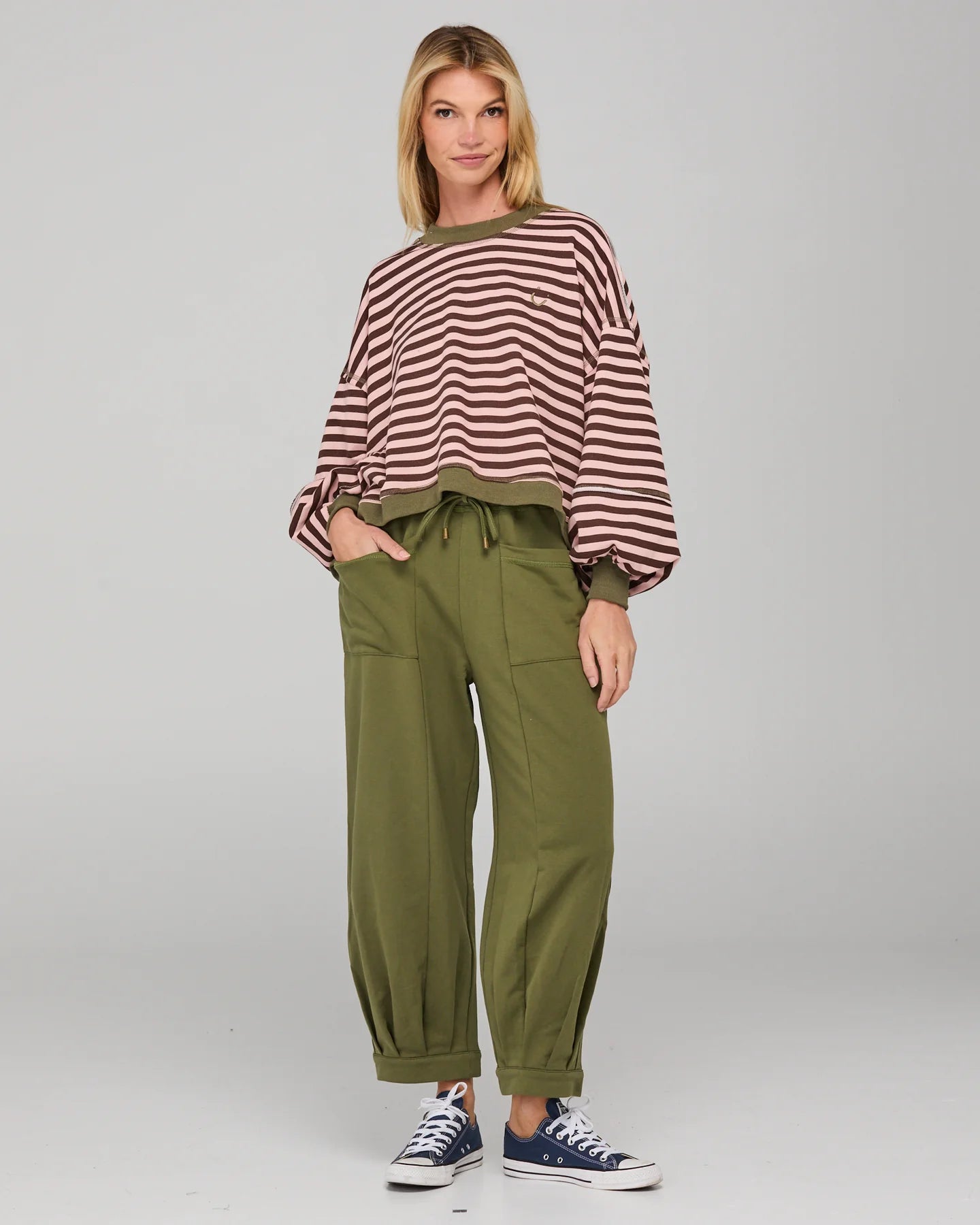 Khaki relaxed fit track pants with drawstring waist, ribbed waistband, contrast stitching and pockets front and back.