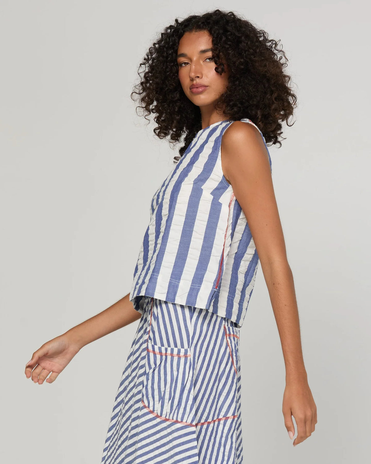 Boom Shankar Hara Top in Ocean Stripe featuring vertical stripes, a high scoop neckline, sleeveless design and fitted silhouette.