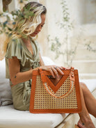 Havana Bag in tan featuring genuine leather with handcrafted cane detailing in a sleek, structured clutch design.
