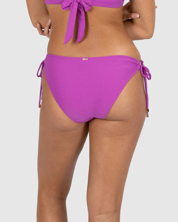 The Hibiscus Tie Side Hipster Bikini Bottom by Baku are available at Rawspice Boutique.