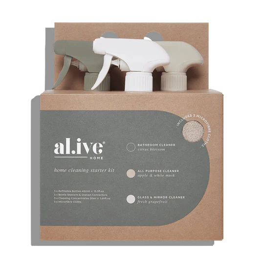 The Al.ive Home Cleaning Starter Kit, featuring three refillable 450ml bottles, each paired with 50ml cleaning concentrates for All Purpose, Bathroom, and Glass & Mirror cleaning. The kit includes three microfibre cloths, three bottle stations with connectors for customizable organization, and a sleek, modern design displayed on a clean countertop. The eco-friendly packaging is made with 30% post-consumer recycled plastic, showcasing a sustainable and effective cleaning solution.