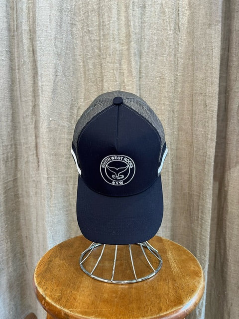 Rocks Hat in navy featuring a whale tail design on the front, snapback closure, and breathable mesh sides for a comfortable, adjustable fit.