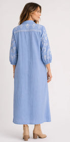 Feather Shirt Dress in soft chambray linen with floral embroidery, button-through front, ankle-length silhouette and side splits.