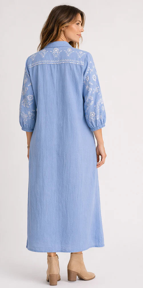 Feather Shirt Dress in soft chambray linen with floral embroidery, button-through front, ankle-length silhouette and side splits.