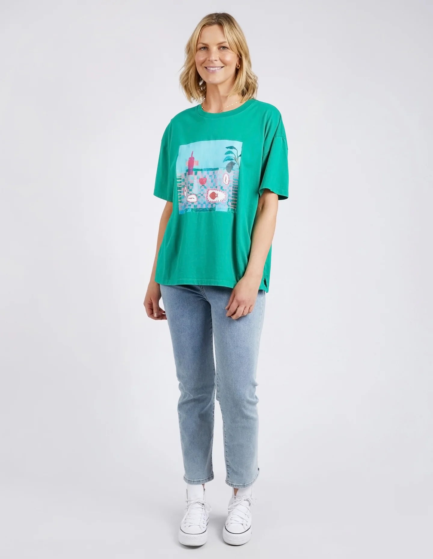 The Goodness Green Island In The Sun Tee by Elm is available at Rawspice Boutique.