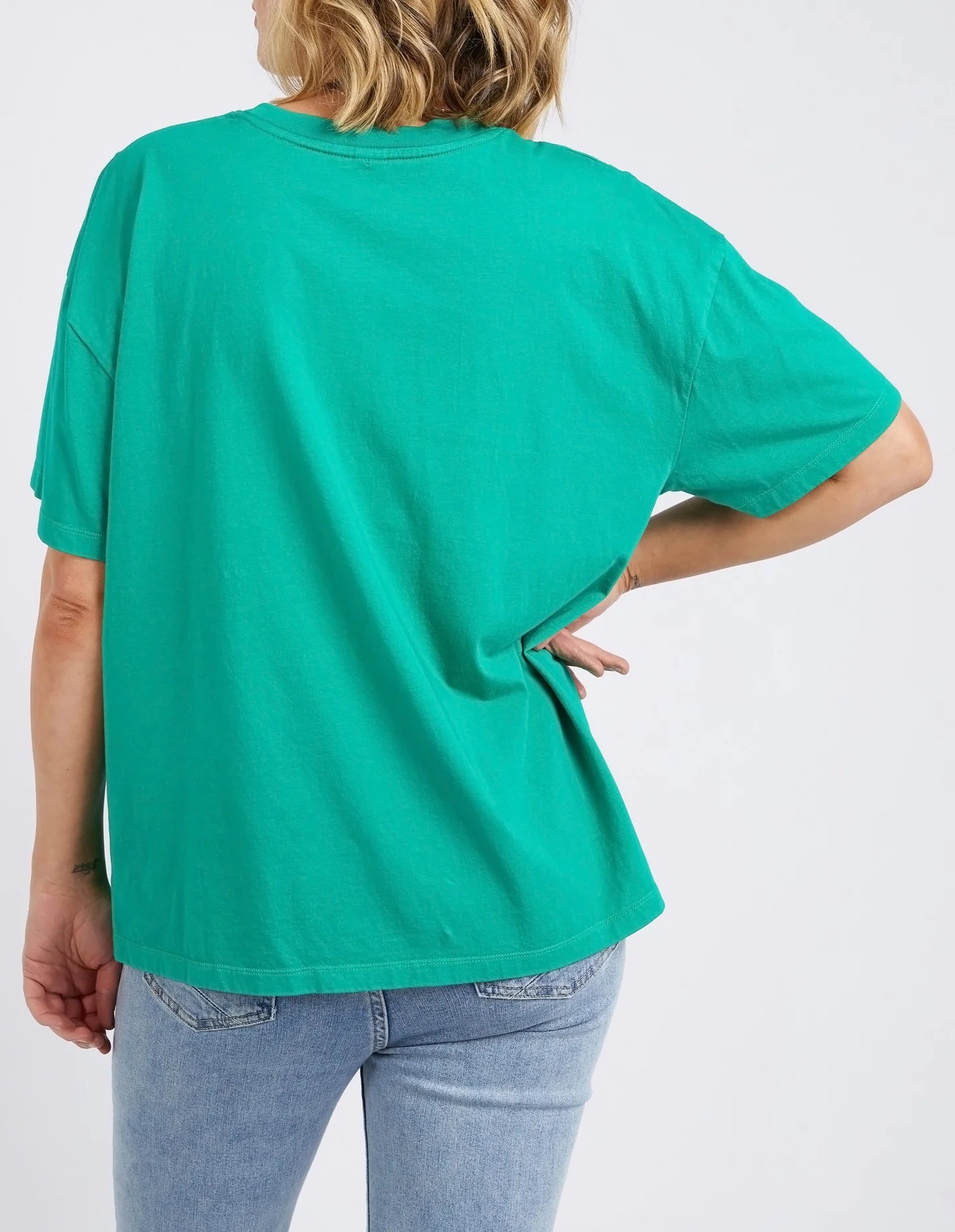 The Goodness Green Island In The Sun Tee by Elm is available at Rawspice Boutique.