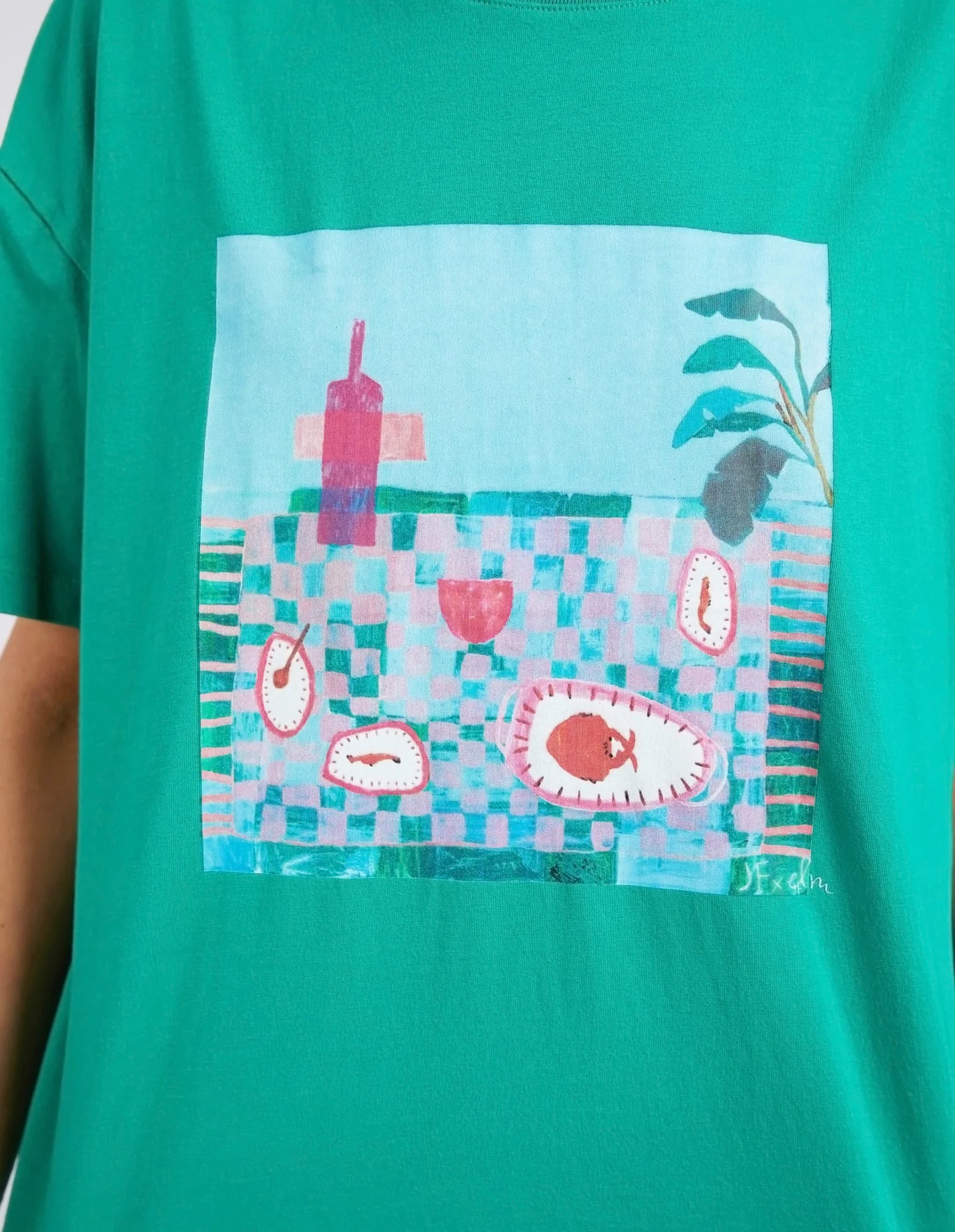 The Goodness Green Island In The Sun Tee by Elm is available at Rawspice Boutique.