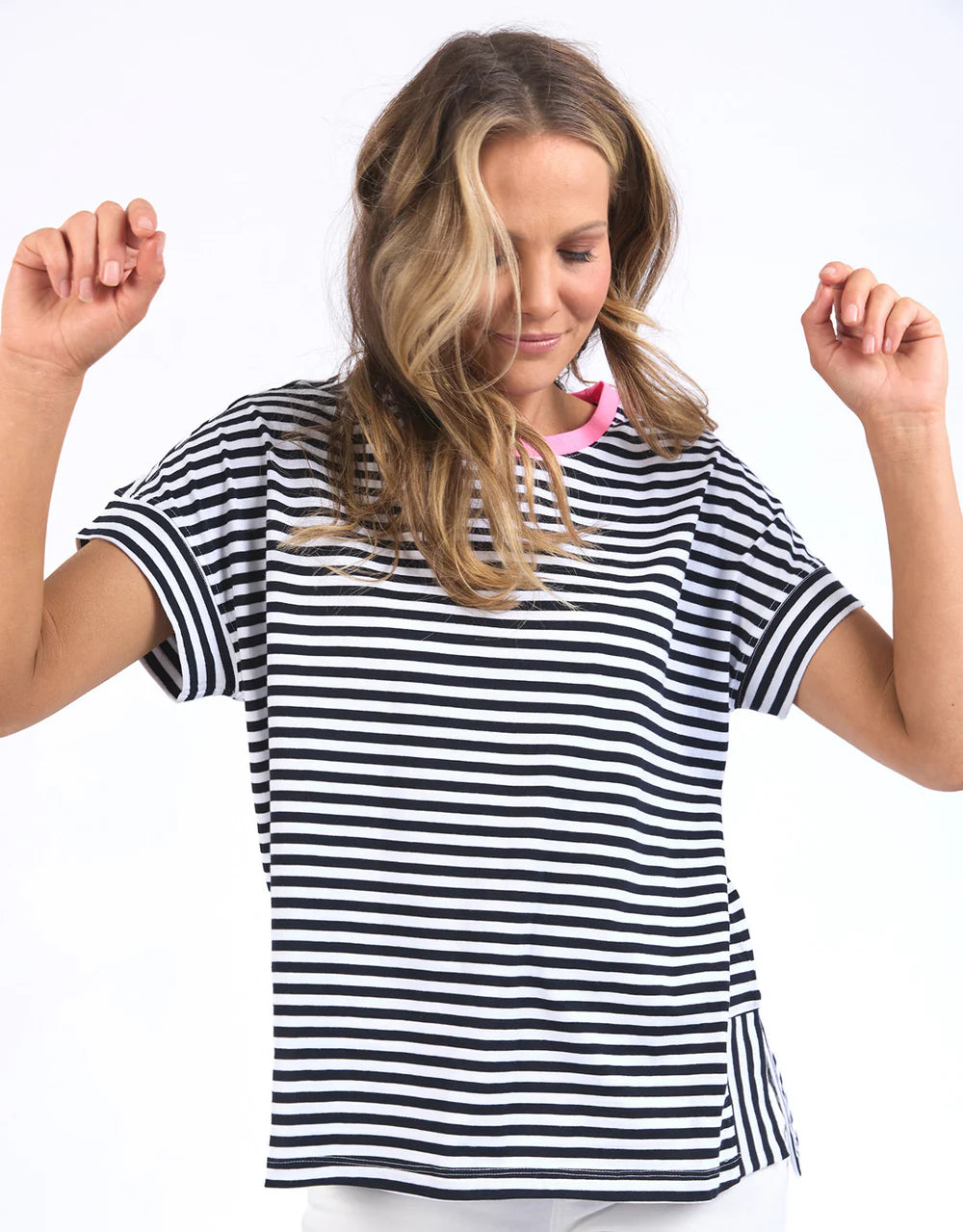 Navy and white striped Jarrah Short Sleeve Tee by Elm with a pink contrast neckline, relaxed fit, cuffed sleeves, and side splits.