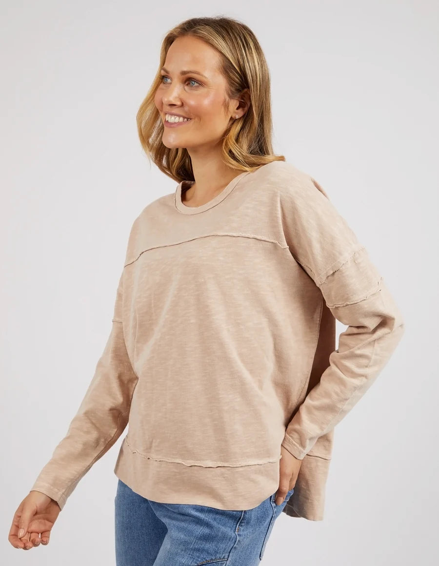 Woman wearing the Jayne Throw On Top, a relaxed lightweight long sleeve perfect for everyday casual styling.