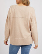 Woman wearing the Jayne Throw On Top, a relaxed lightweight long sleeve perfect for everyday casual styling.
