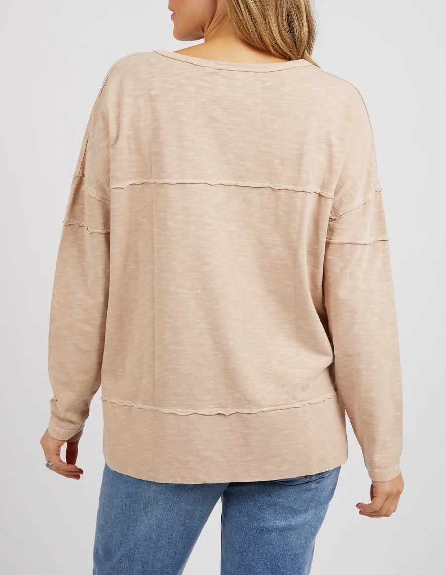 Woman wearing the Jayne Throw On Top, a relaxed lightweight long sleeve perfect for everyday casual styling.
