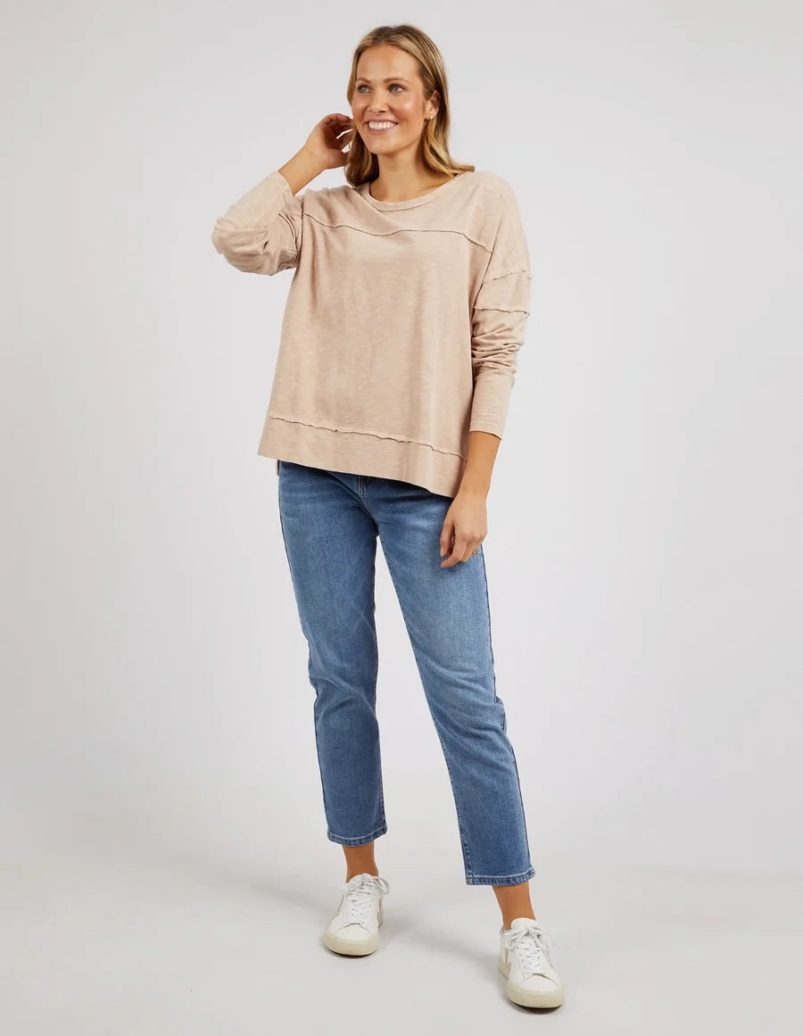Woman wearing the Jayne Throw On Top, a relaxed lightweight long sleeve perfect for everyday casual styling.