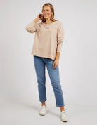 Woman wearing the Jayne Throw On Top, a relaxed lightweight long sleeve perfect for everyday casual styling.