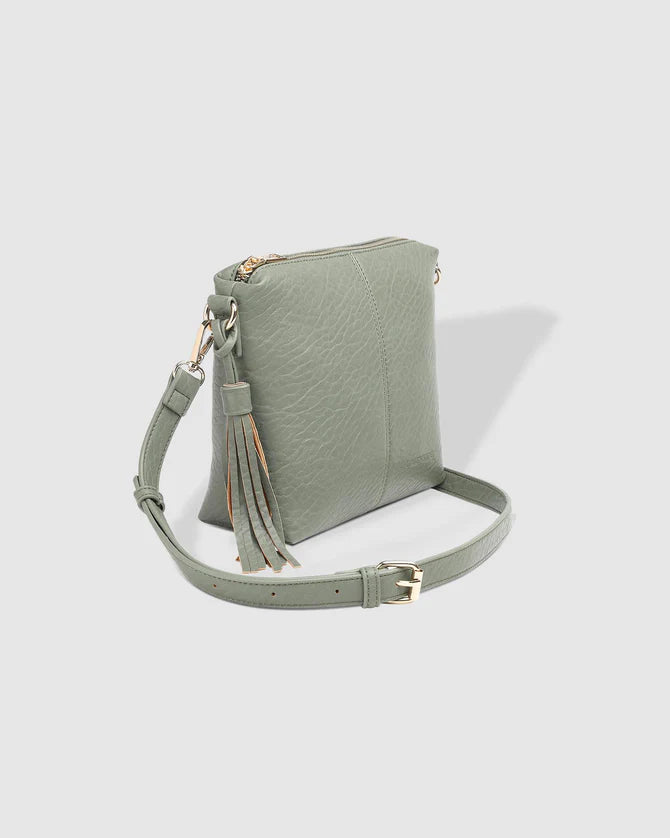 The Light Khaki Kasey Textured Crossbody Bag With Logo Strap by LOUENHIDE are currently available at Rawspice Boutique.