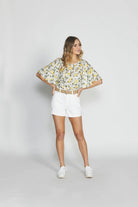 The White Keira Denim Shorts by SASS are currently available at Rawspice Boutique.