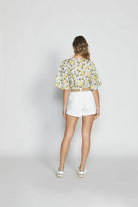 The White Keira Denim Shorts by SASS are currently available at Rawspice Boutique.