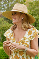 Kimberley Raffia Fedora in natural with 13cm wide brim, 10cm crown, brown leather tassel trim, ComfyFit adjustable band, and removable chin strap.
