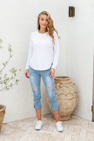 Winter White Zip Back Knit Jumper with a high scoop neckline, long sleeves with turned-up cuffs, dropped shoulders, and silver zipper detail at the back.