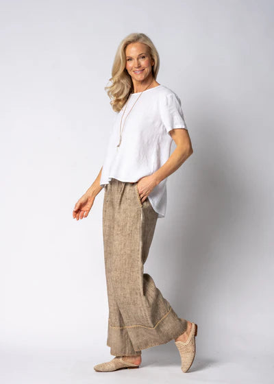 Latte full-length linen pants made from 100% lightweight, breathable linen. Designed with an airy, relaxed cut for unrestricted movement and all-day comfort, offering a clean, timeless look suitable for warm-weather wear