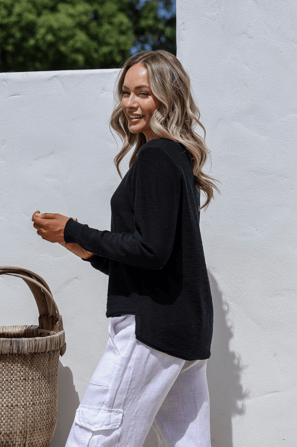 Black 100% cotton light knit top with a breathable, timeless design, ideal for layering or wearing alone for everyday comfort and style.