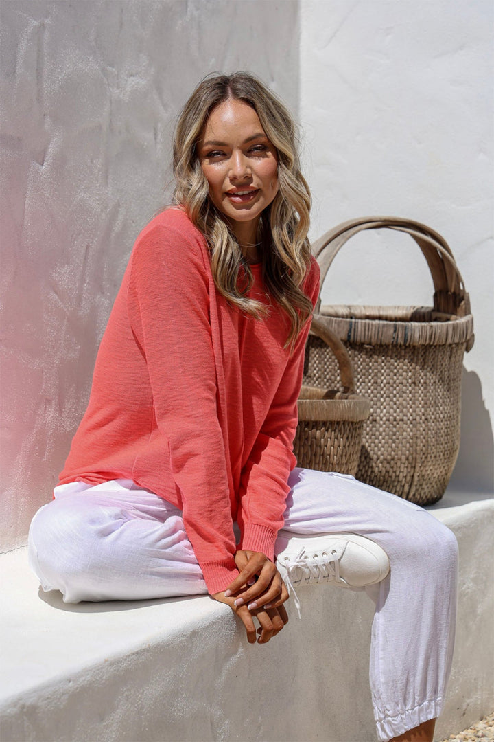 Coral 100% cotton light knit top with a breathable, timeless design, ideal for layering or wearing alone for everyday comfort and style.