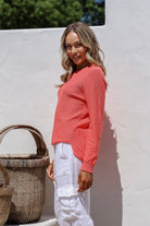 Coral 100% cotton light knit top with a breathable, timeless design, ideal for layering or wearing alone for everyday comfort and style.