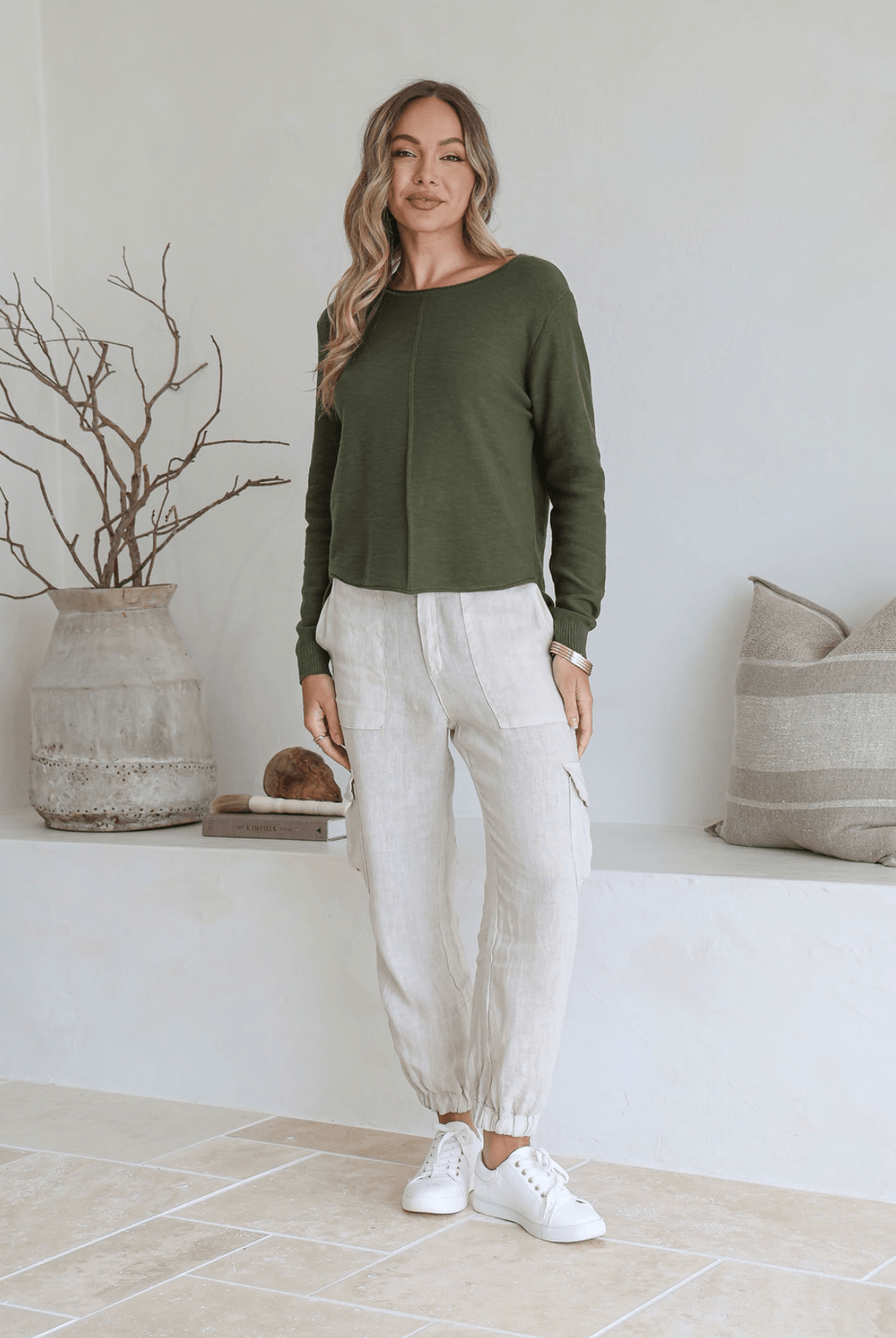 Moss 100% cotton light knit top with a breathable, timeless design, ideal for layering or wearing alone for everyday comfort and style.