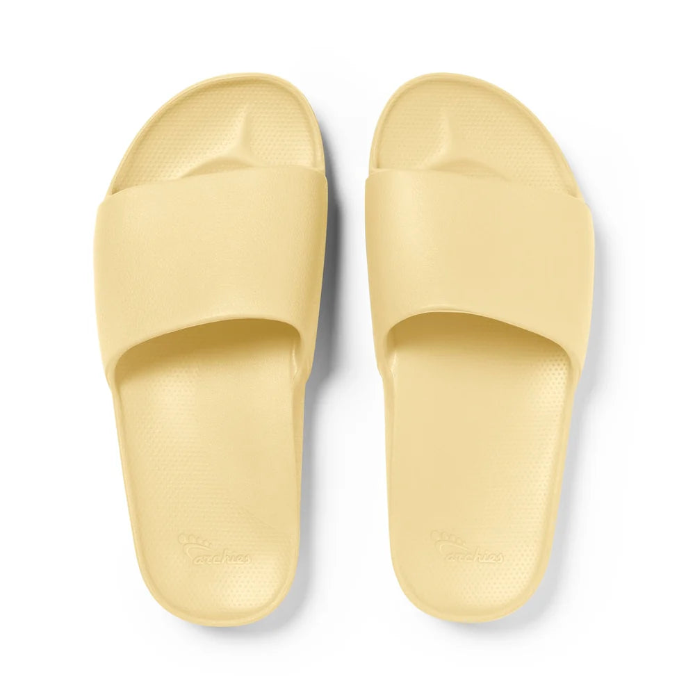 A pair of lemon-yellow arch support slides with a contoured footbed, thick cushioned soles, and an open-toe design, providing comfort and support for everyday wear.