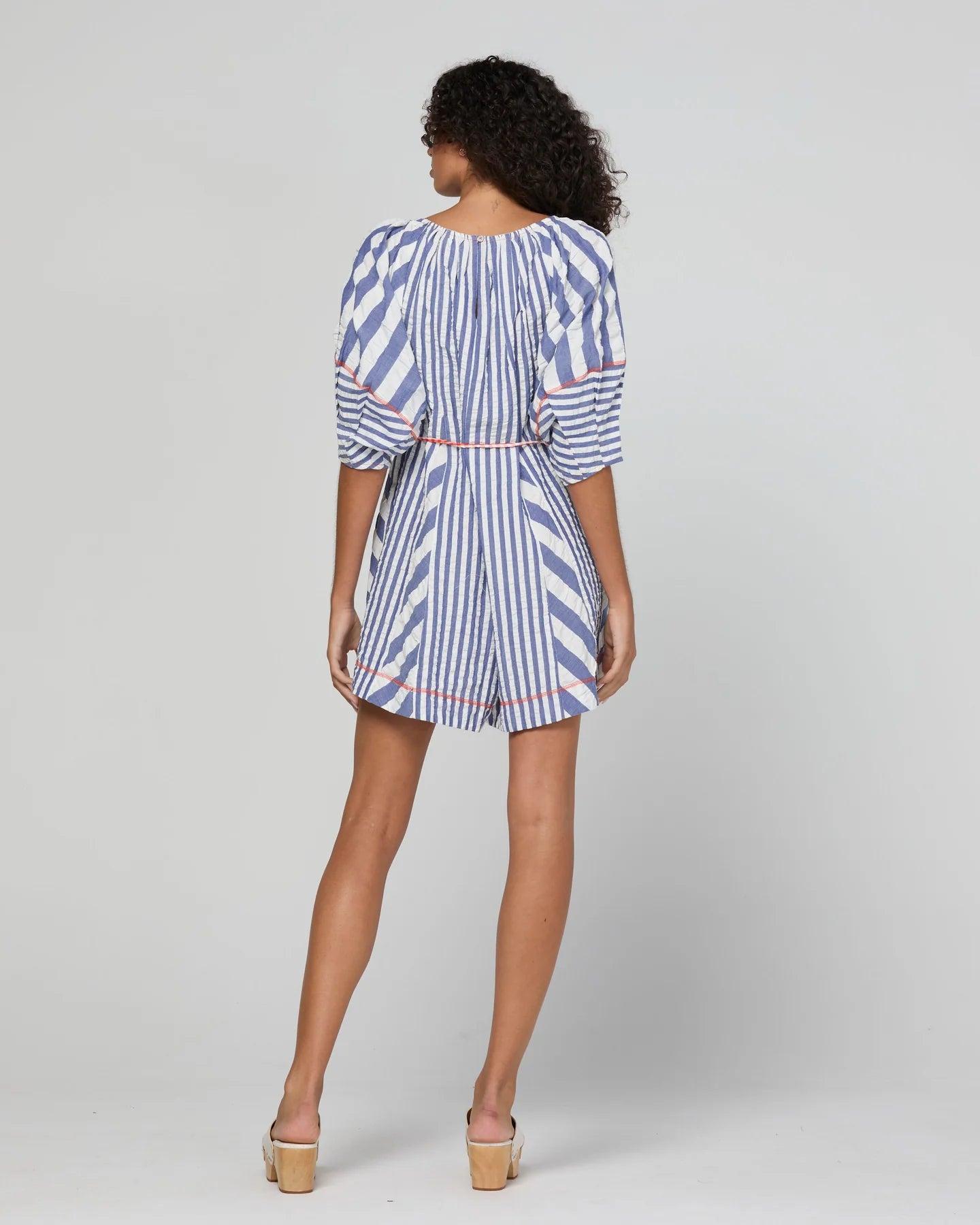Boom Shankar Lucia Playsuit in Ocean Stripe with a tie neckline, balloon sleeves, contrast cuffs, gingham waist tie and relaxed fit.