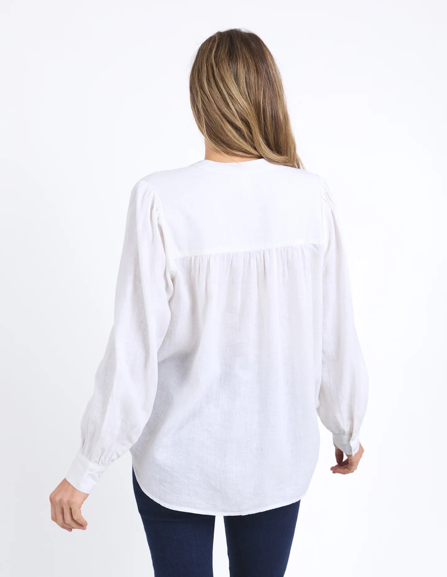 Long sleeve Marshmallow blouse with a front placket, button cuffs, and round collar, crafted from a soft linen blend for an elegant, easy-to-layer style.