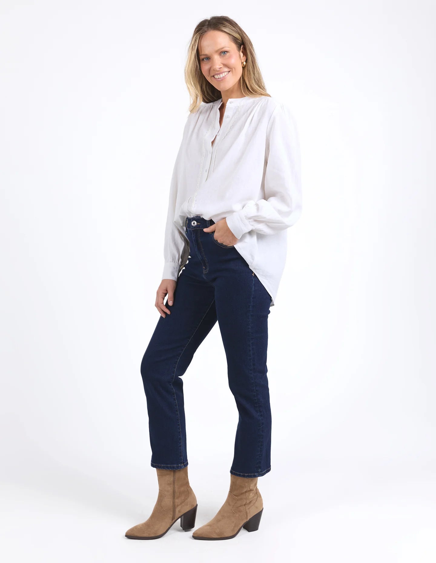 Long sleeve Marshmallow blouse with a front placket, button cuffs, and round collar, crafted from a soft linen blend for an elegant, easy-to-layer style.