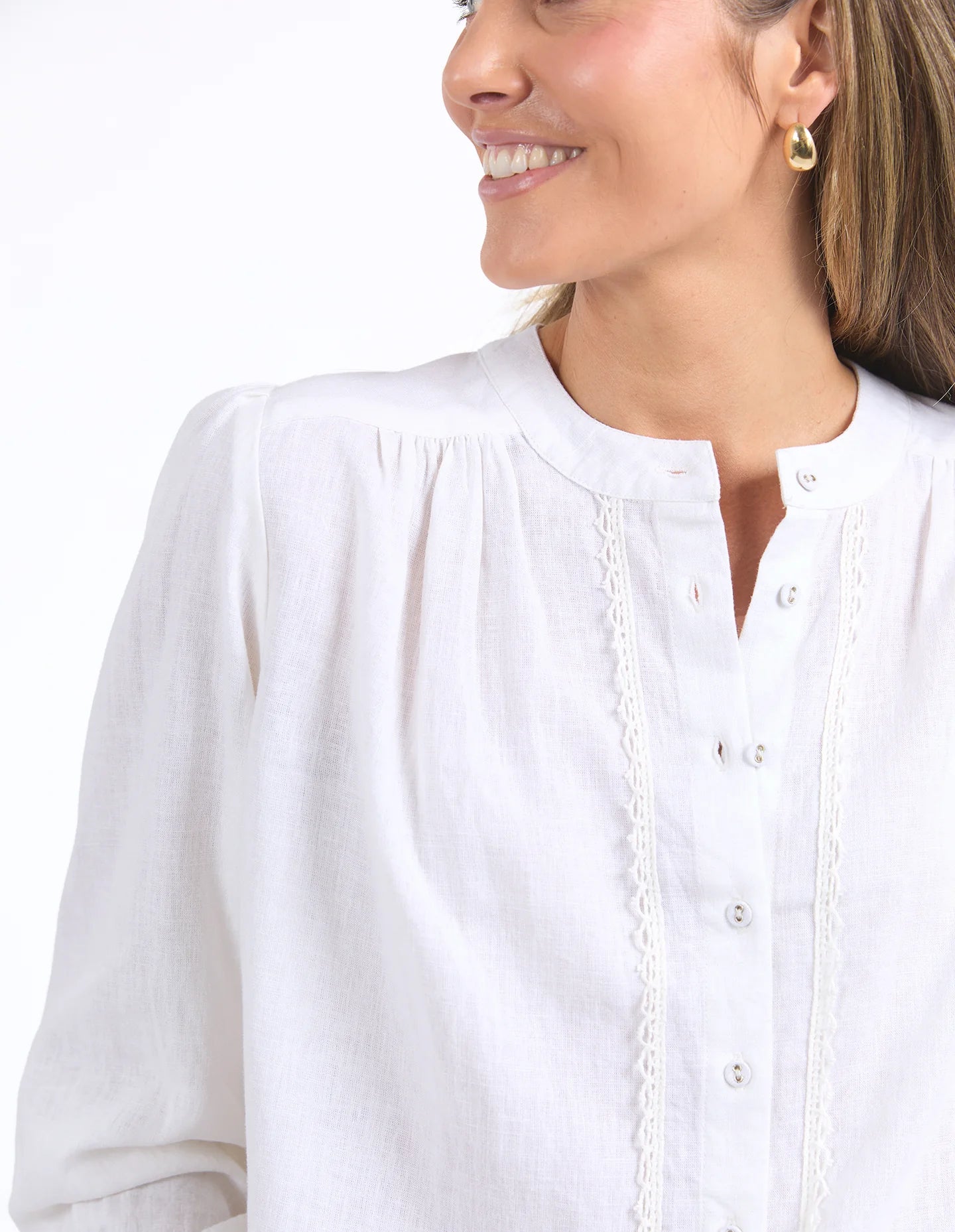 Long sleeve Marshmallow blouse with a front placket, button cuffs, and round collar, crafted from a soft linen blend for an elegant, easy-to-layer style.