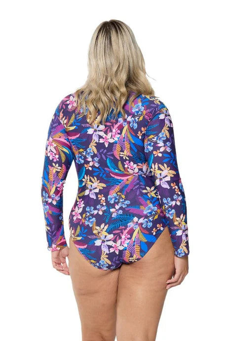 A tropical floral Majorca long sleeve one-piece swimsuit with a zippered neckline, flattering curve-enhancing fit, and rich inky blue base.