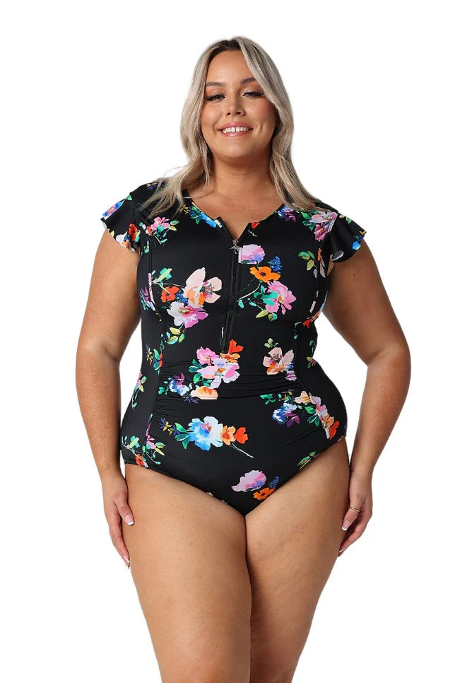 A woman modelling Plus Size Swim Wear in the Malibu Frill Sleeve One Piece by Capriosca