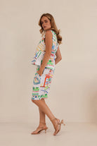 Vibrant Marrakesh print linen shorts with mid-thigh length, relaxed fit, two side pockets, and a tailored waistband with zip and hook closure.